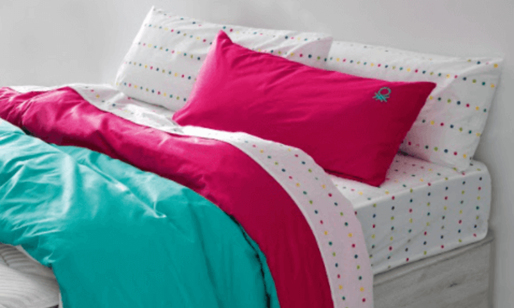 decorar cama con cojines